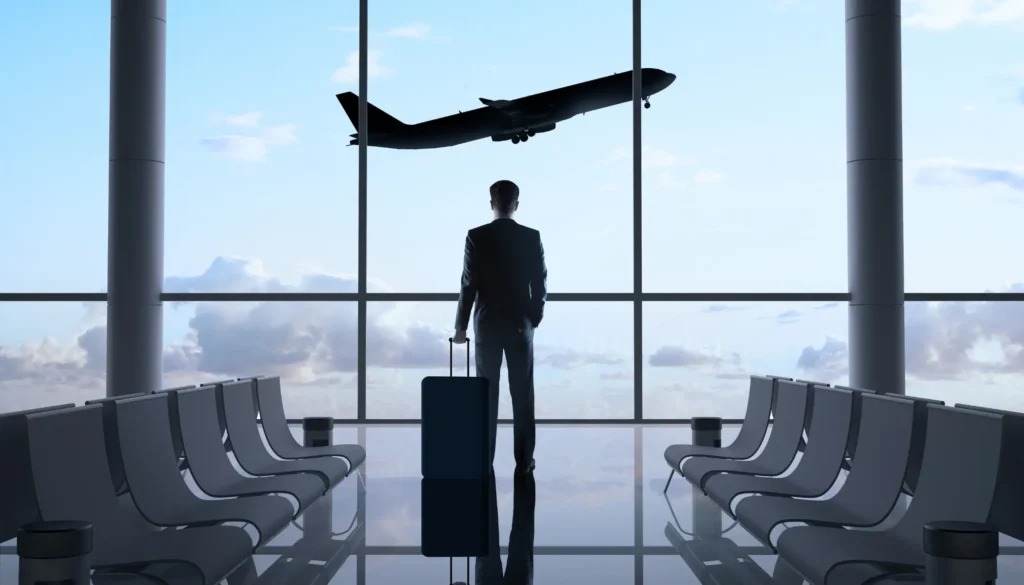 man in airport The investment migration industry at a crossroads feat